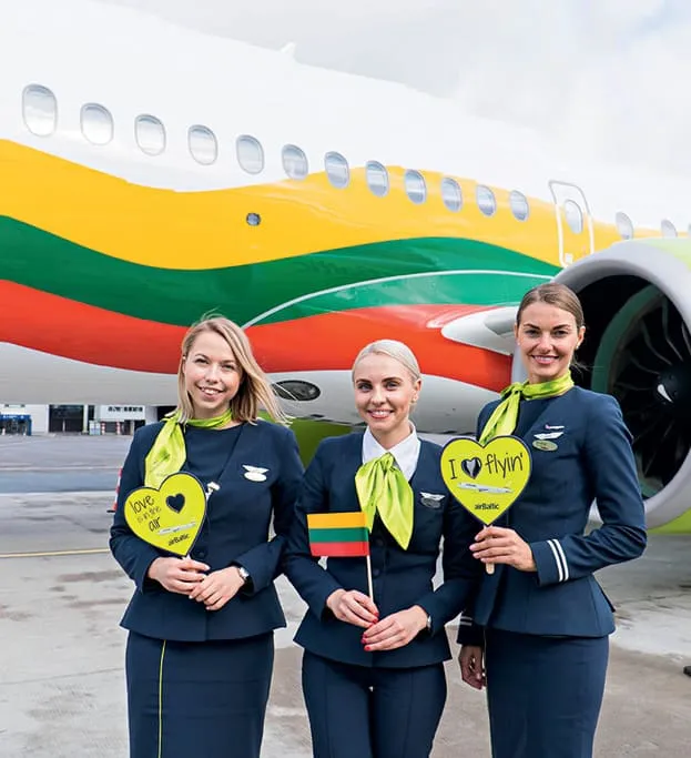Crew in front of special livery aircraft